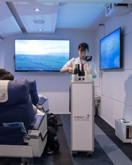First Airlines. Flight Attendant. Ikebukuro Tokyo Japan. VR Virtual Reality flight - World's first virtual aviation facility. Photo François Cavelier